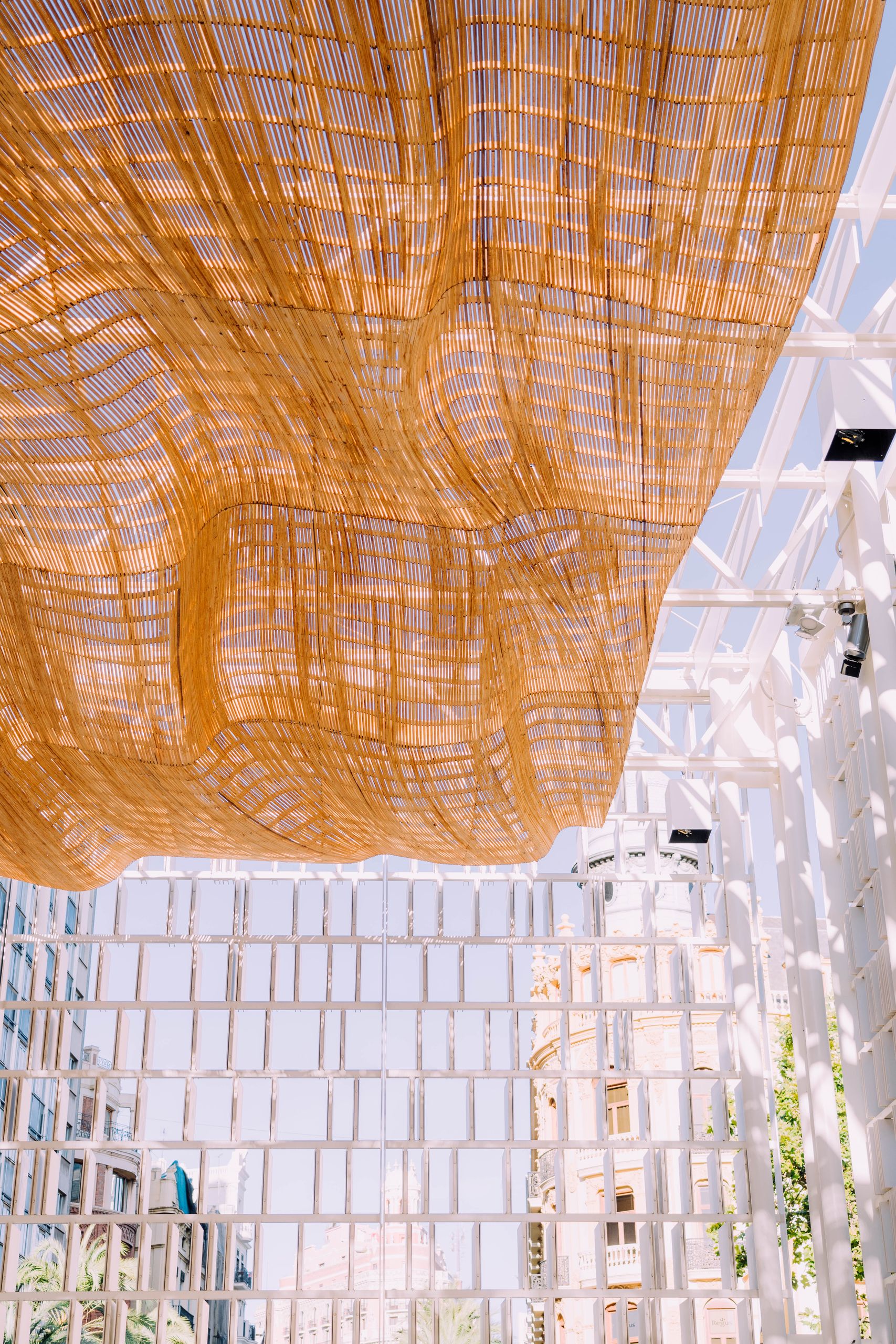 Modern architectural design features a woven canopy in Valencia, Spain.
